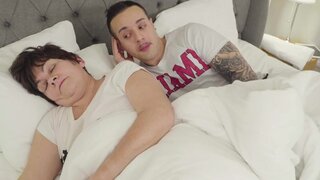 Hung boy shares bed with busty mother-in-law