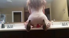 cute riding dildo in front of mirror