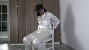 Handcuffed in satin pyjamas
