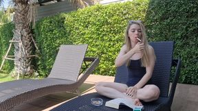 Lina Roselina is smoking a cigarette outdoors while flashing her tits