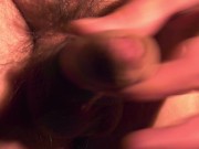 Adult man jerk offs his dick with two fingers and hand (close up)