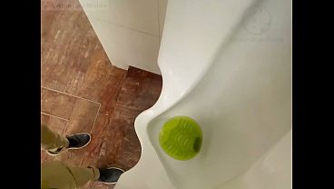 Amateur redhead guy caught pissing in a public toilet'_s urinal - he then quickly plays with his cock before leaving