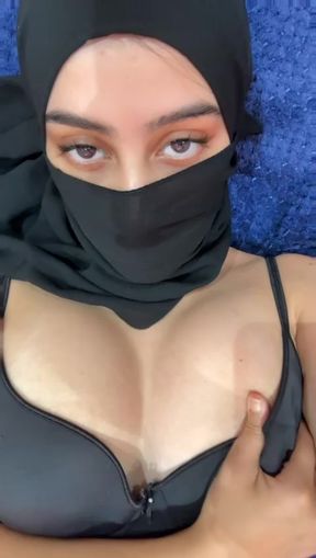 Muslim babe in hijab teases her round arab boobs while squeezing and jiggling her soft titties