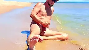 Nudist Couple Having Pegging Session On The Beach