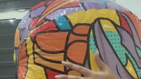 Blowing a beach ball