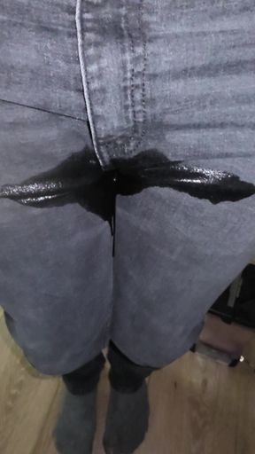 Desperate wetting black jeans in my living room