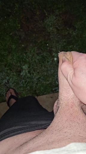 Cumshot outdoors at night