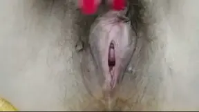 Hairy babe plays with her toy after a dirty pee session