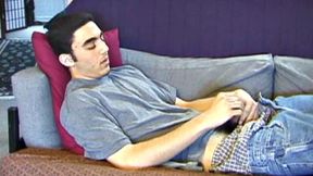 After a close-up of jeans being unzipped, Karod kicks back on the sofa and rubs a growing bulge through his boxers. If his complexion is less than perfect, his lean torso, hairy legs and thick happy trail more than compensate.