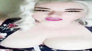 Chesty platinum-blonde woman is showcasing her bosom on live webcam, just for the joy of it