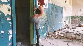 boots, jeans and crushing tease in an abandoned building
