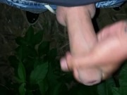 Cum is leaking on hand and is rubbed onto cock like sticky juice outdoor
