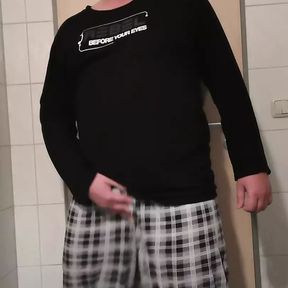 Dennis wanks in the hotel bathroom.