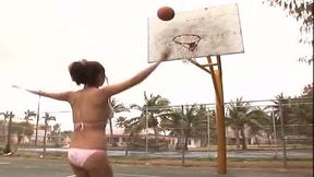 Busty brunette teen Mai Nishida plays baskeball in her bikini outfit