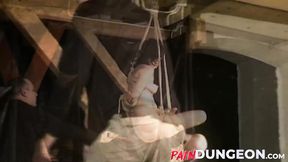 ”Gagged brunette is spanked by master in dungeon play”