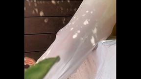 A boy has fun watering his friend'_s white t-shirt and exposing his smooth ass and big cut cock