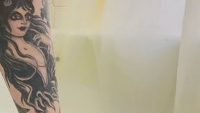 Tattooed legs in the shower