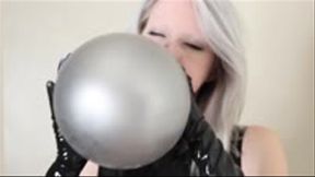 Latex Babe Blows and Plays With Balloons