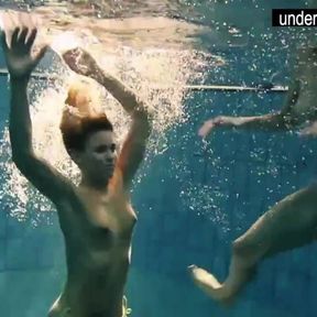 Two sexy amateurs showing their bodies off under water