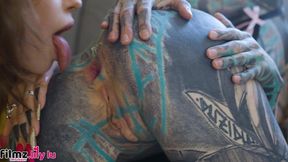 alt-punk teen girls share a tattoo cock