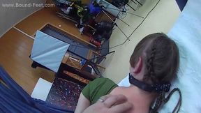 Ballgagged barefoot Amanda in green leotard, hogtied with red hemp rope with her elbows tightly tied, is tickled by the man - POV video (HD MP4)