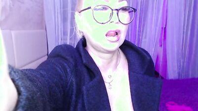 A cool busty vulgar mature whore in glasses with a ponytail on her head...