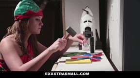 Tiny elf Lizzie Bel working extra hours for Santa in his bedroom