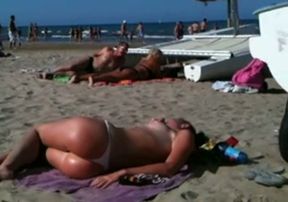 Perfect topless blonde ass on the beach exposing her butt and tits