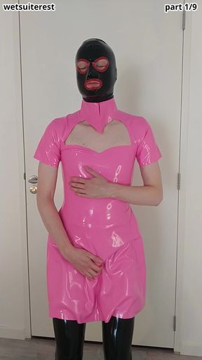 Putting on pink latex maid dress over rubber stockings and transparent pants