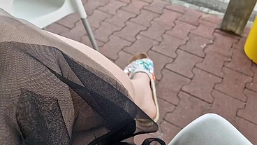 Sexy dangling sweaty slippers at the bar