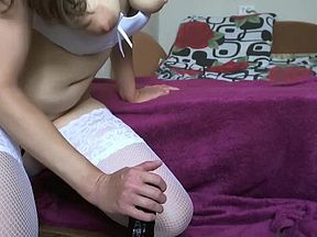 Girl in stockings and heels rides a big black dildo