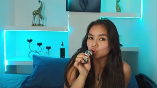 Cute latina masturbates while holding a plug