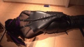 Gothgirl in Monoglove bound on the Floor