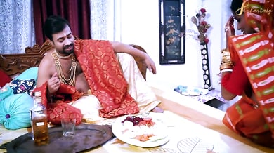 Passionate lovers entwined in a richly decorated bedroom adorned with gold and silk