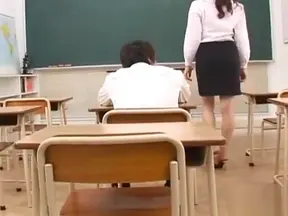Excited Japanese Teacher Indulges in Hot Threesome with Students' Passionate Acts