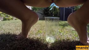 MILF Tans Naked Outside and Pissing in a Tall Glass