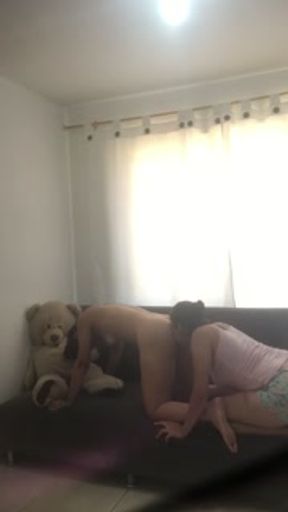 Two hot girls fuck in the living room scissoring and sucking their tits