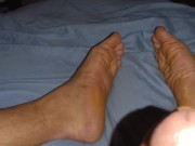 Watching porn while stroking dick with wrinkled male soles