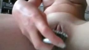 Sassy nympho stuffs her tight pussy with a hairbrush