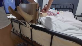 Wooden yoke restrains the transvestite