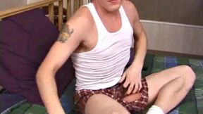 Relaxed on the bed, Timmy unzips his jeans and pulls out his cock. He strokes to the porn video he's watching. After edging himself a few times, the young man spills a messy cum load onto his stomach.