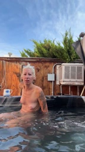 Piss Slut floating in her hot tub and pissing like a fountian!!