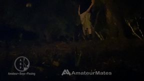 amateur boy caught pissing in a park, at night