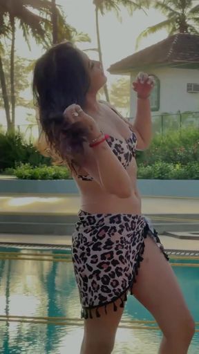 Swimsuit model posing by pool