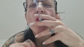 Cigarette smoke comes out between my teeth with a wide smile