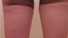 Desperate wetting in yoga shorts outside bathroom