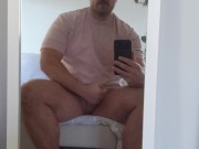 Rugged bear wearing baseball cap wanks and blows on mirror