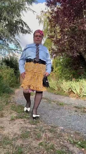 Dressed casually with a short yellow skirt with flowers for an evening out