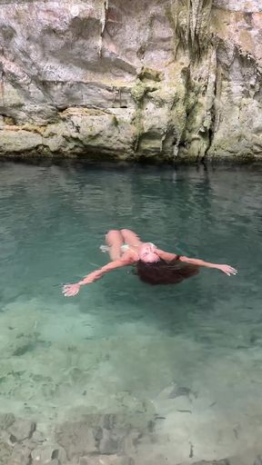 Slim blonde amateur lies on a Cenote La Isla beach, enjoying her solo