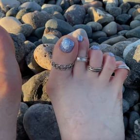 Hot and sexy feet of Mistress Lara in the sunset on public beach